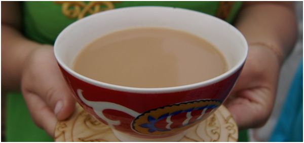 tea with milk in a cup with a pattern