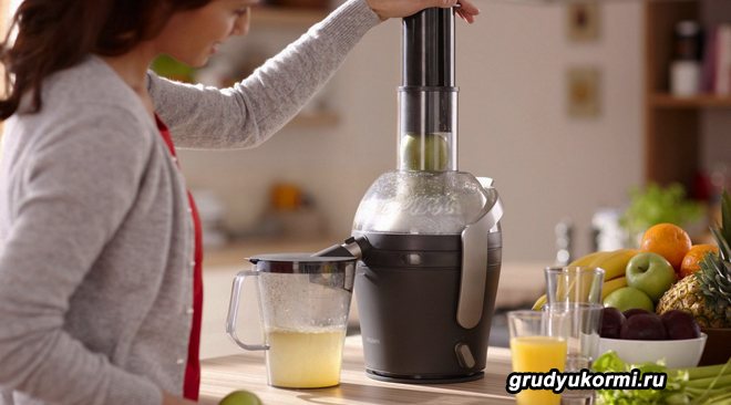 Girl using a juicer