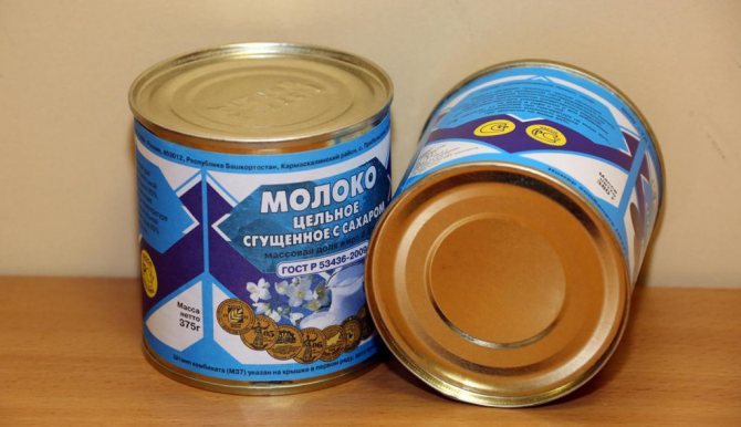 Two cans of condensed milk on the table