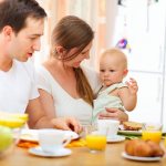 baby at the table with parents