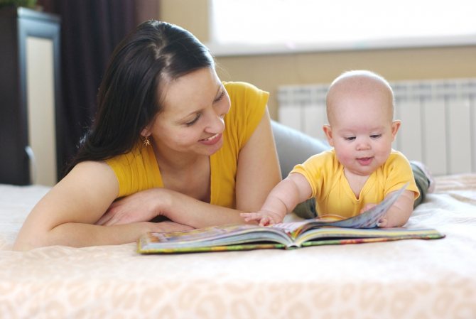 Mom reads to baby