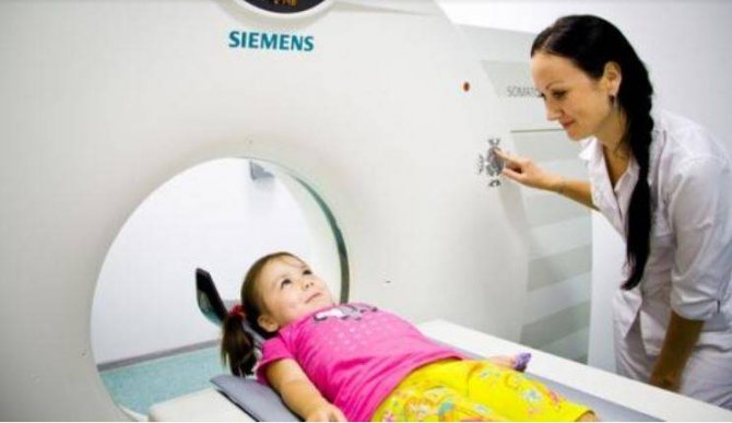 Position of the child on the CT scanner table before the examination