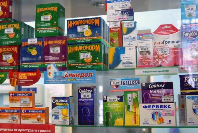 Soluble powders for flu and colds on a pharmacy shelf