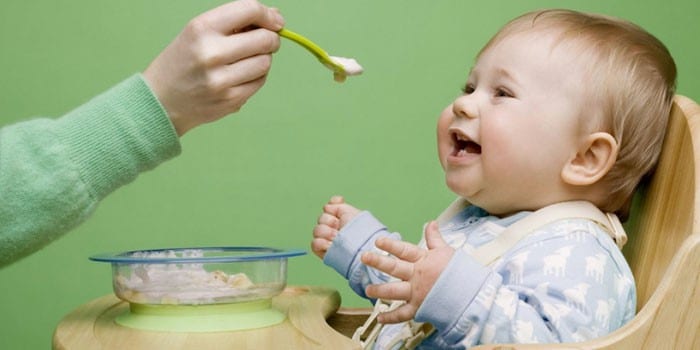 Baby being fed from a spoon