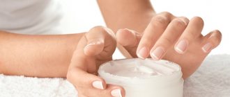 woman&#39;s hands and cream