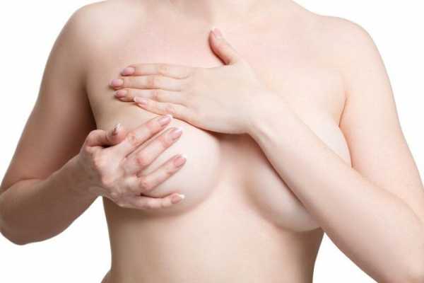 Hand expressing breasts