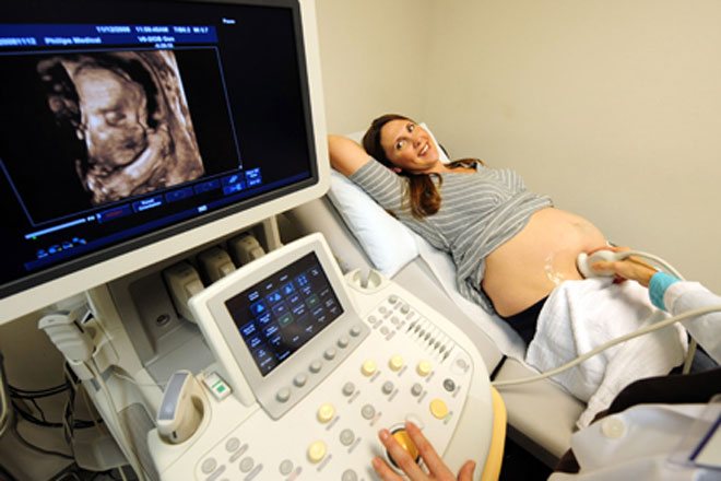 A woman undergoes an ultrasound procedure